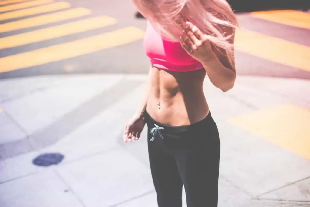 Woman with toned stomach after LA-EMS Body Sculpting Treatment Amersham